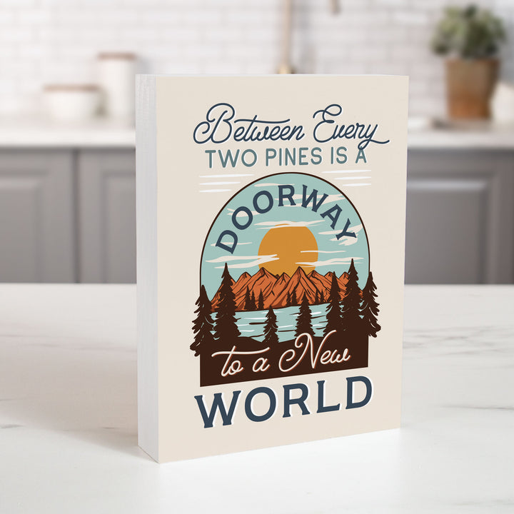 **Between Every Two Pines Is A Doorway To A New World Wood Block Décor
